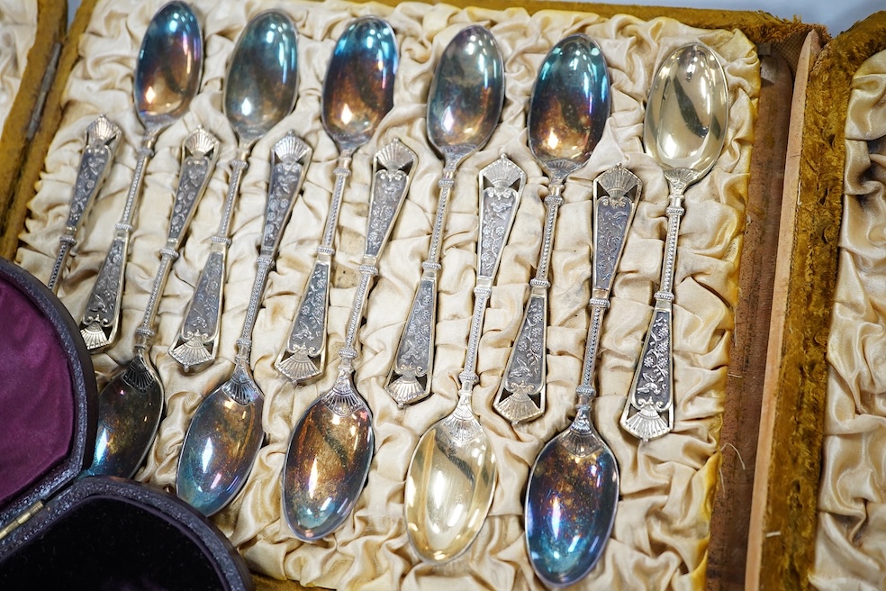 A cased set of twelve late Victorian silver gilt coffee spoons, by Elkington & Co, Birmingham 1890, one other later incomplete set of silver teaspoons and a Victorian cased silver apostle spoon. Condition - fair